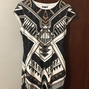 Black and gold sequin dress.